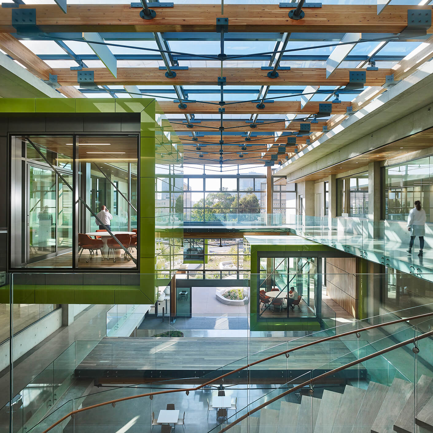 Central atrium with green meeting pods