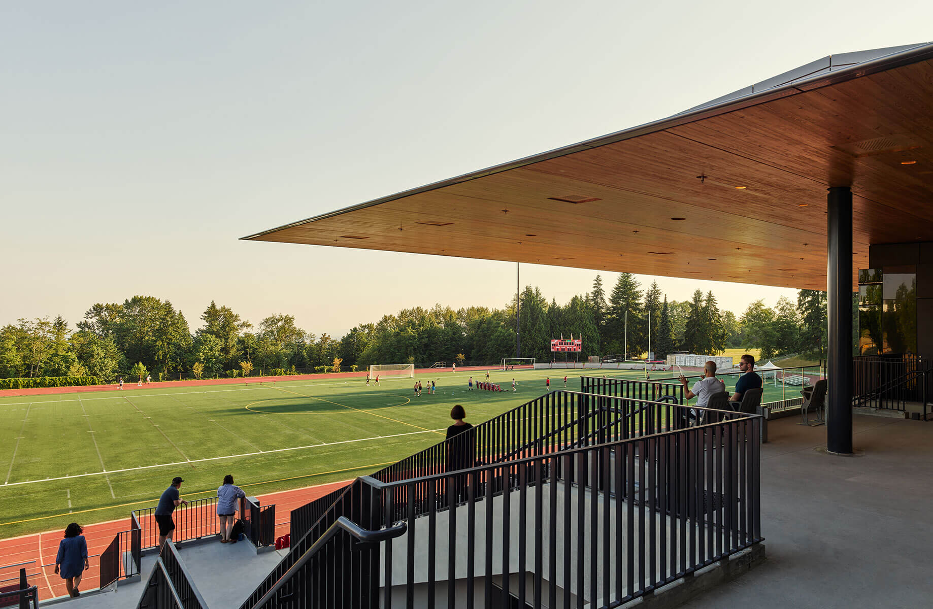 View of the field under the stadium canopy from the terrace level.