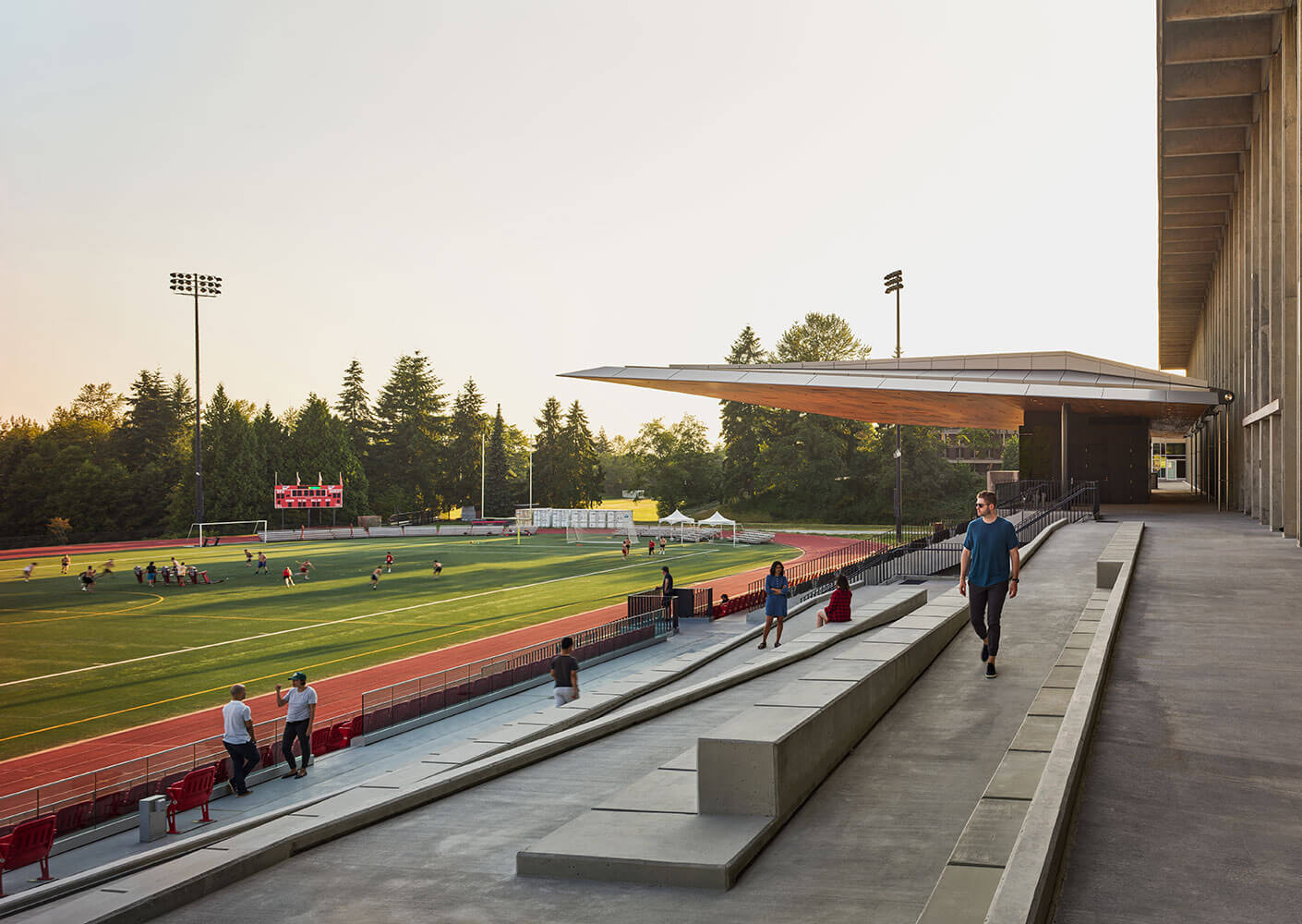 A view of the stadium from the terrace level showing the informal seating area and ramp in the foreground.