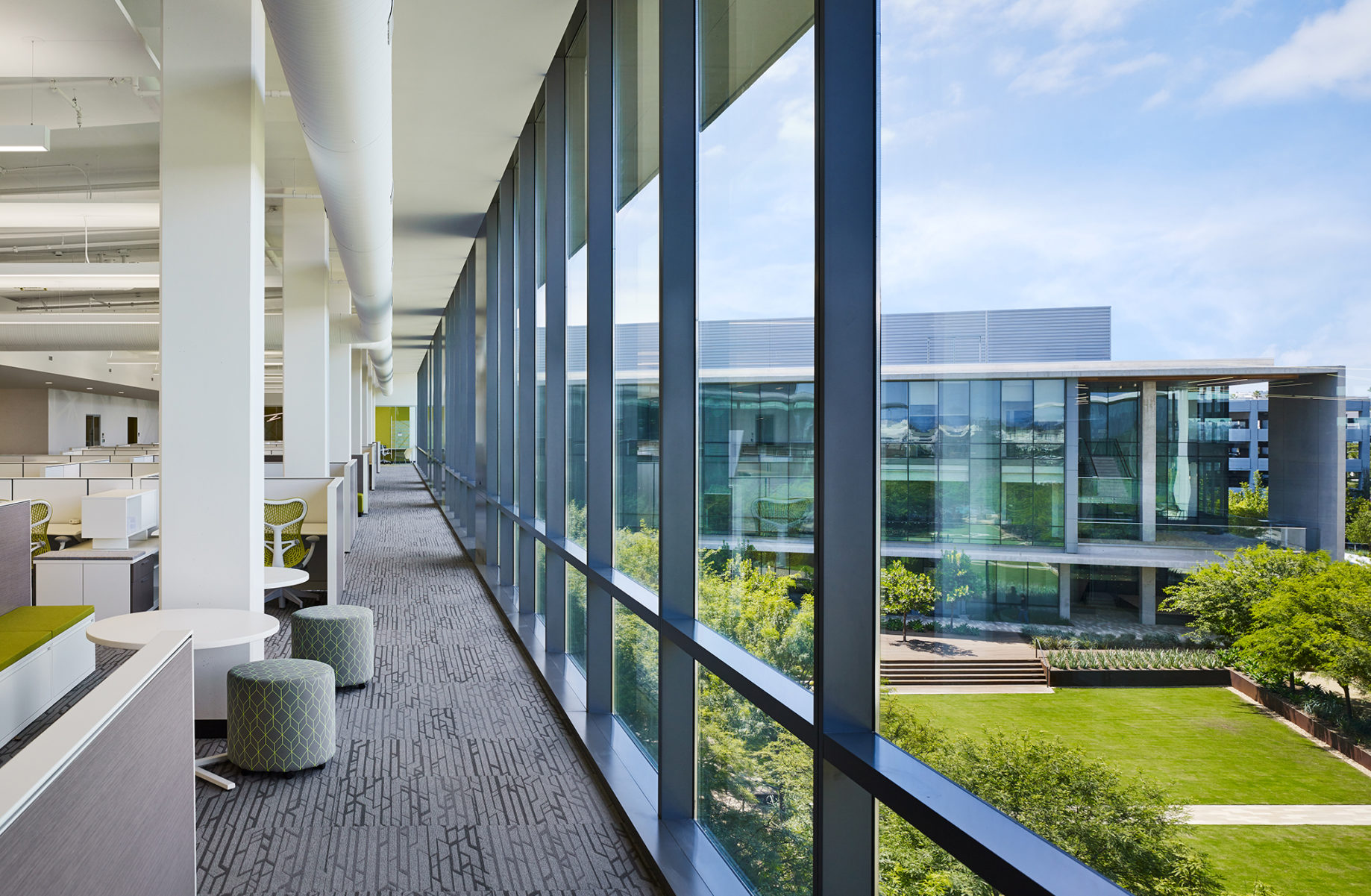 i3 Illumina third floor open office with view to courtyard.