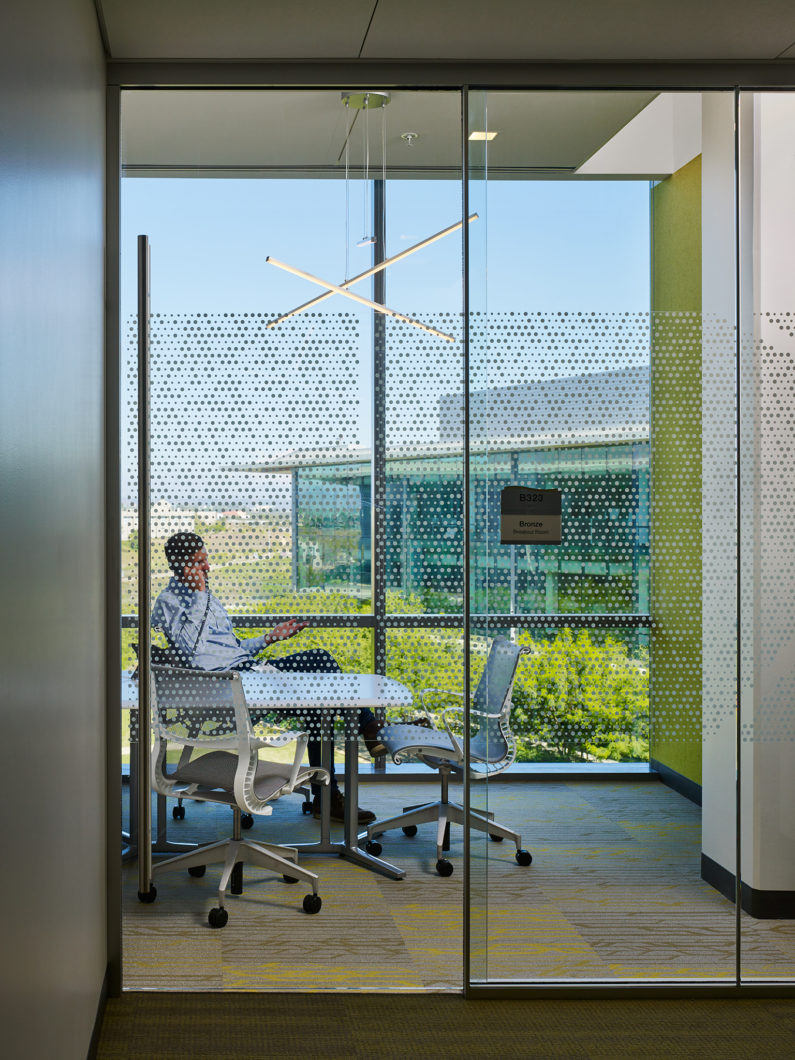 i3 Illumina Man on Phone in Conference Room