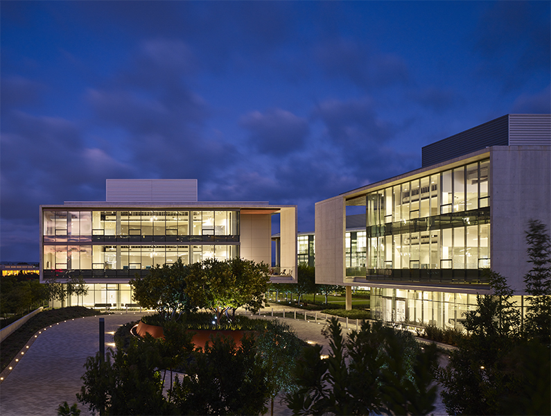 i3 Illumina campus at night, illuminated by interior lights