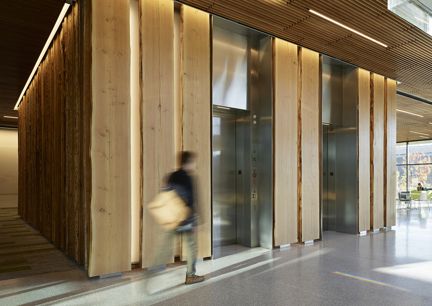 Elevator core wrapped in natural wood