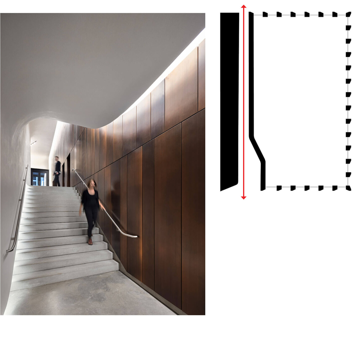 Photo of person walking down stairs to rear entrance of lobby with another individual exiting the elevator in the background.