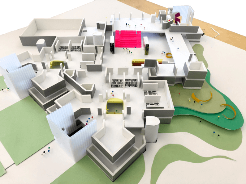 An architecture model of the project, cut from various colors of paper